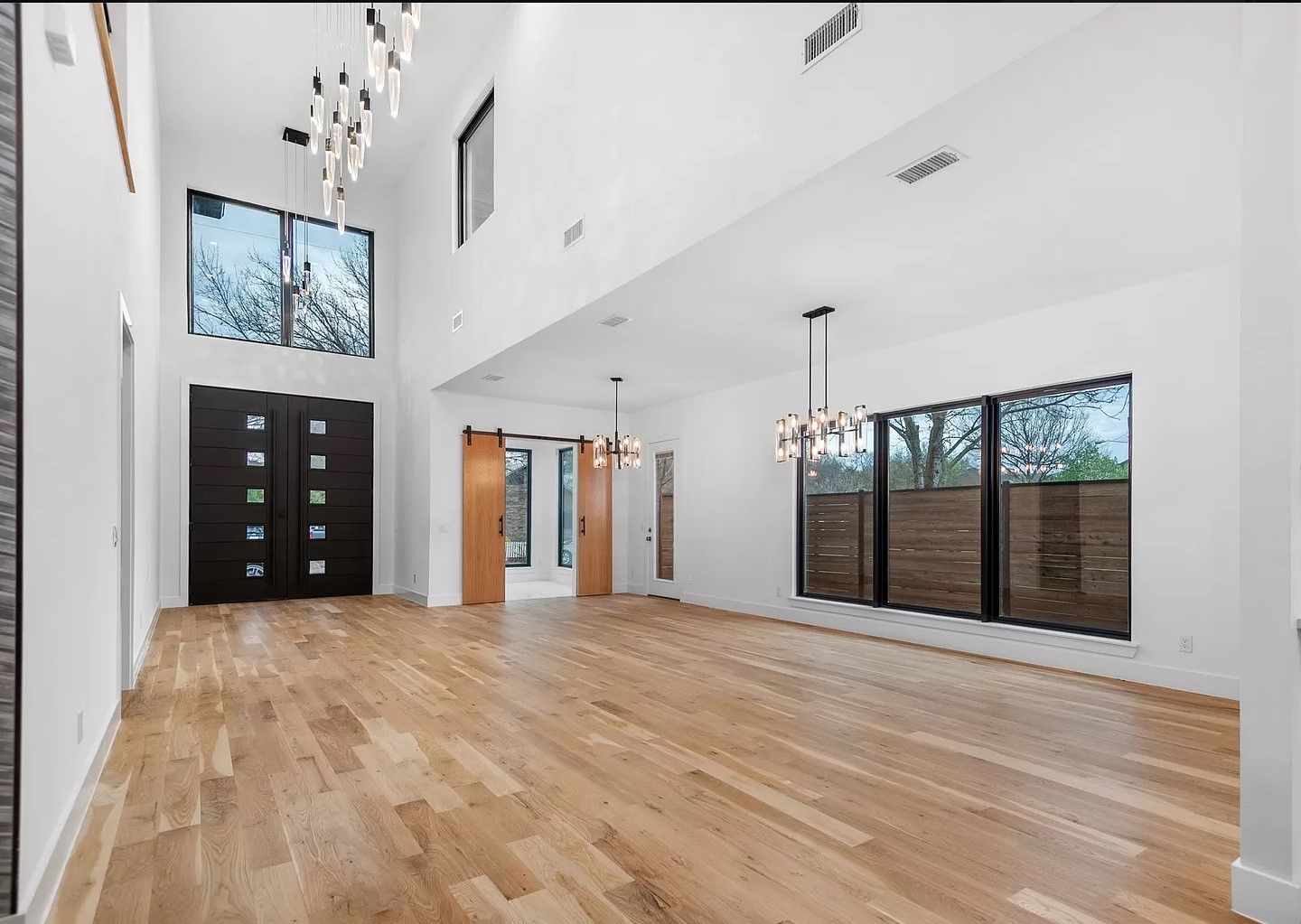 Finished living room with double-height glass